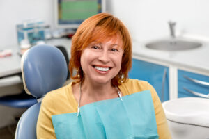 red head in dental chair