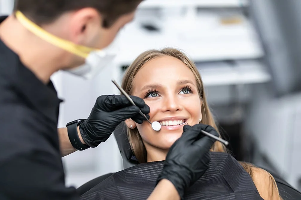 Happy patient in dental chair