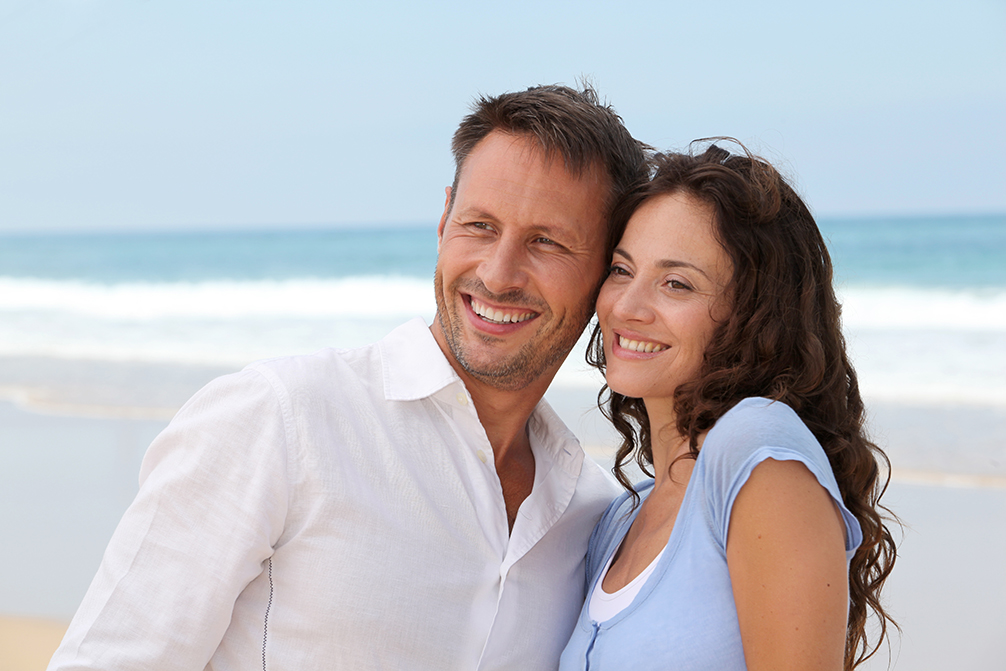 Smiling couple at the beach